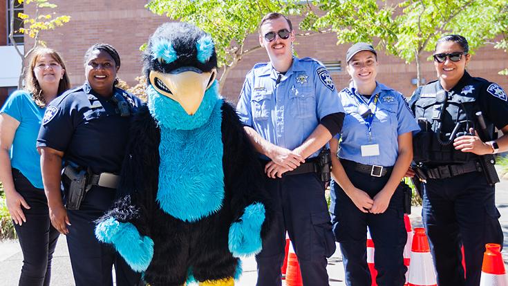 Members of LRPD and campus staff with Falco